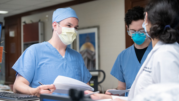 Radiologists view images on computer screens in a reading room Radiologists view images on computer screens in a reading room
