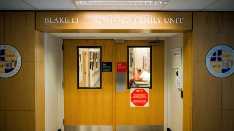 front of newborn family unit front of newborn family unit