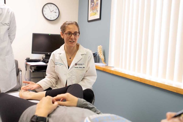 A doctor examines a patient. A doctor examines a patient.