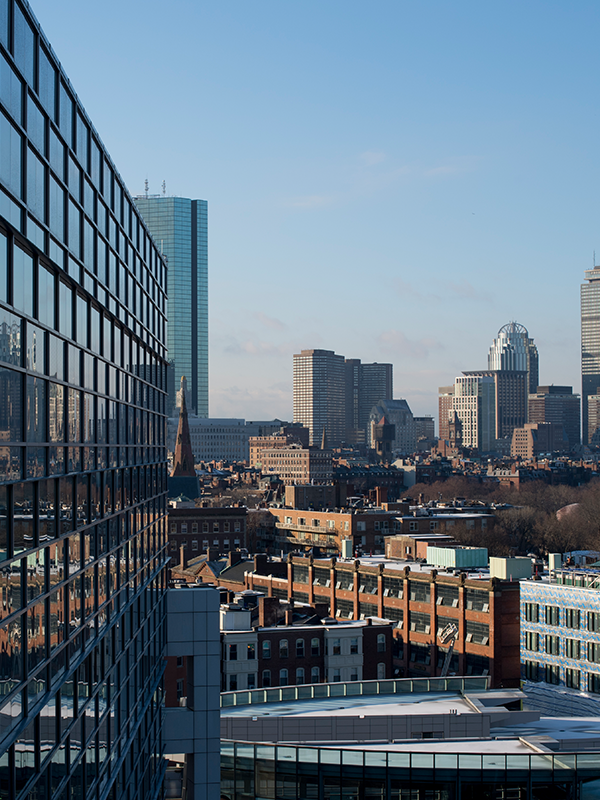 View of Boston skyline next to side of building